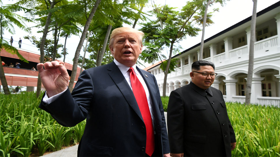Donald Trump walks with North Korean leader Kim Jong Un-3 Donald Trump walks with North Korean leader Kim Jong Un-3