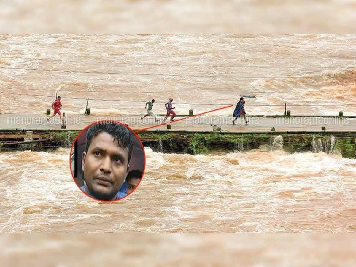 एनडीआरएफ कांस्‍टेबल कन्‍हैया कुमार ने बच्‍चे को गोद में लेकर पुल पार किया.(फोटो क्रेडिट: malayala manorama)