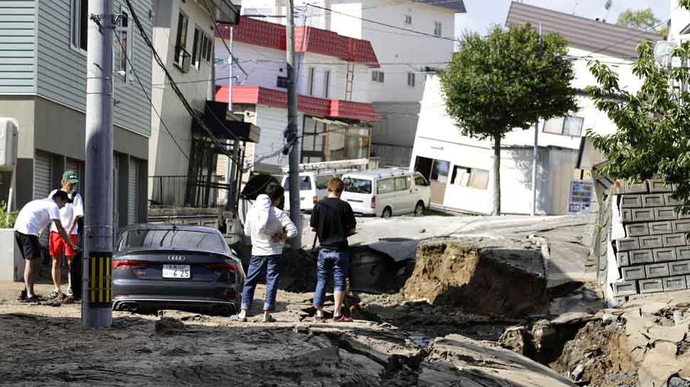 30 लाख घरों में छाया अंधेरा People react during blackout after a powerful earthquake hit the area in Sapporo