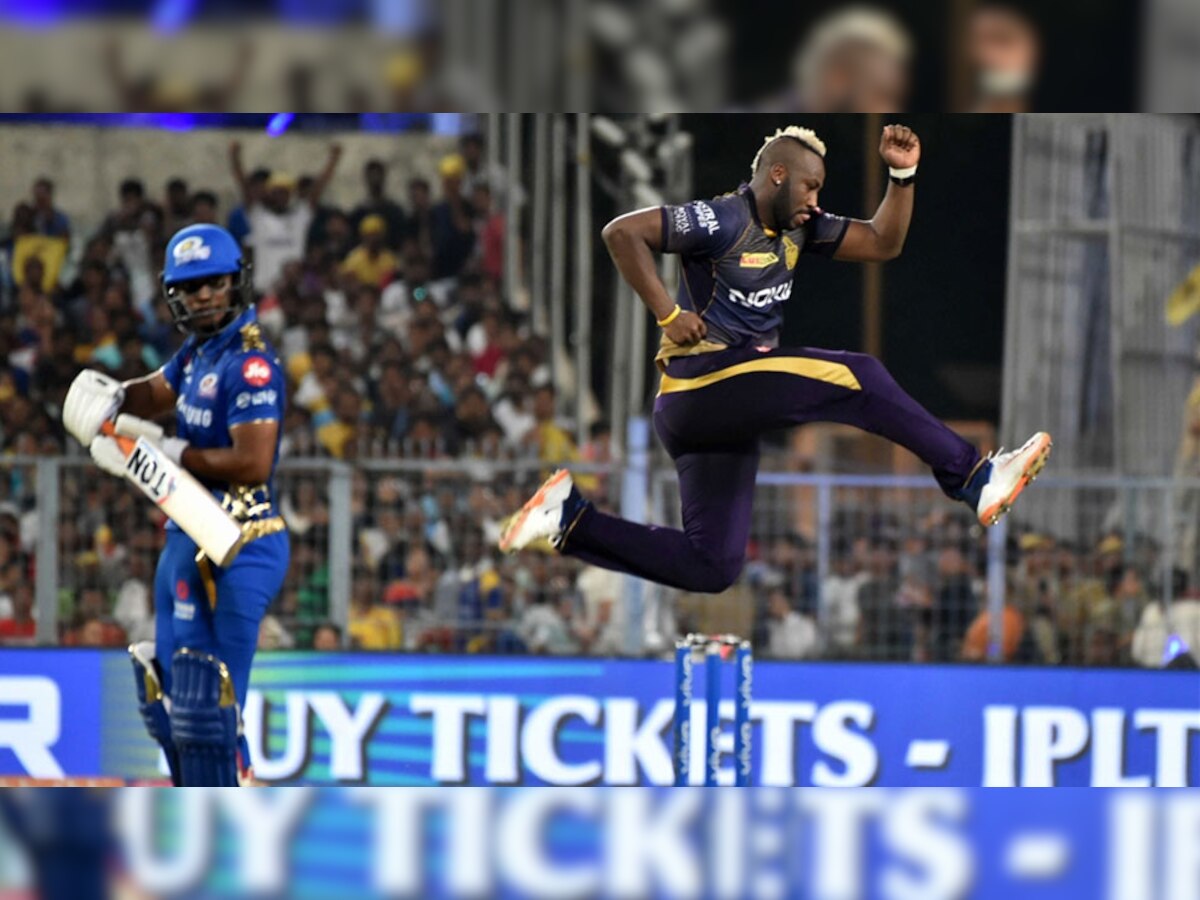मुंबई के खिलाड़ी का विकेट लेने के बाद उछलते हुए केकेआर के आंद्रे रसेल. (फोटो: IANS)