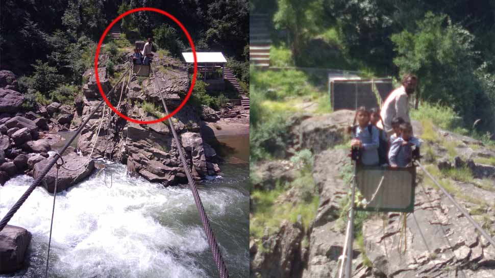 उधमपुरः ट्रॉली की रस्सी टूट जाने से नदी पार कर रहे बच्चे बीच में ही फंसे उधमपुरः ट्रॉली की रस्सी टूट जाने से नदी पार कर रहे बच्चे बीच में ही फंसे