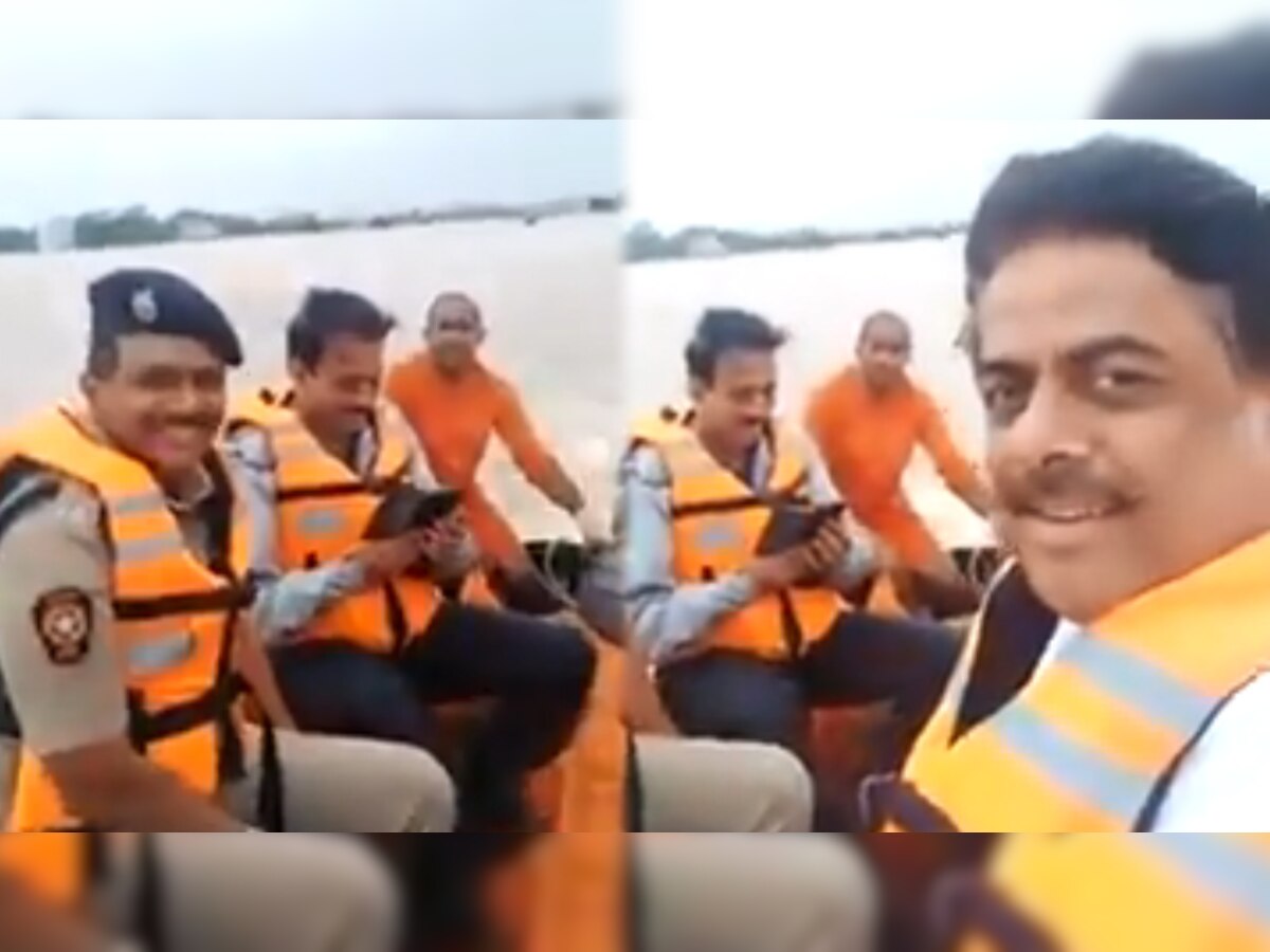 महाराष्ट्र के मंत्री गिरीश महाजन बाढ़ग्रस्त इलाके के दौरे में हंसते हुए नजर आए (साभार: वीडियो ग्रैब)