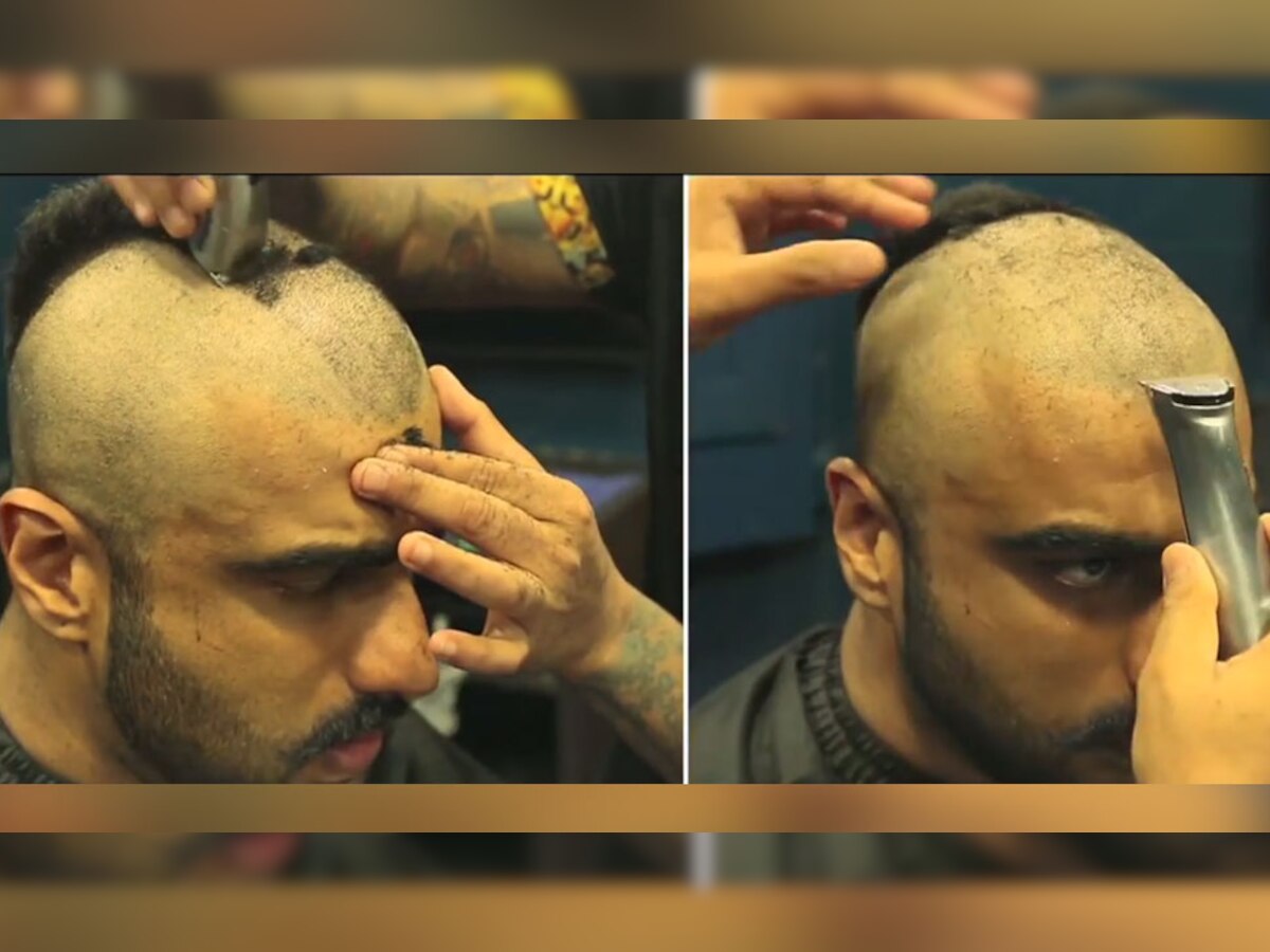 इस वीडियो में अर्जुन एक सलून में बैठकर अपने बाल उतरवाते दिख रहे हैं (फोटो साभारः वीडियो, इंस्टाग्राम)