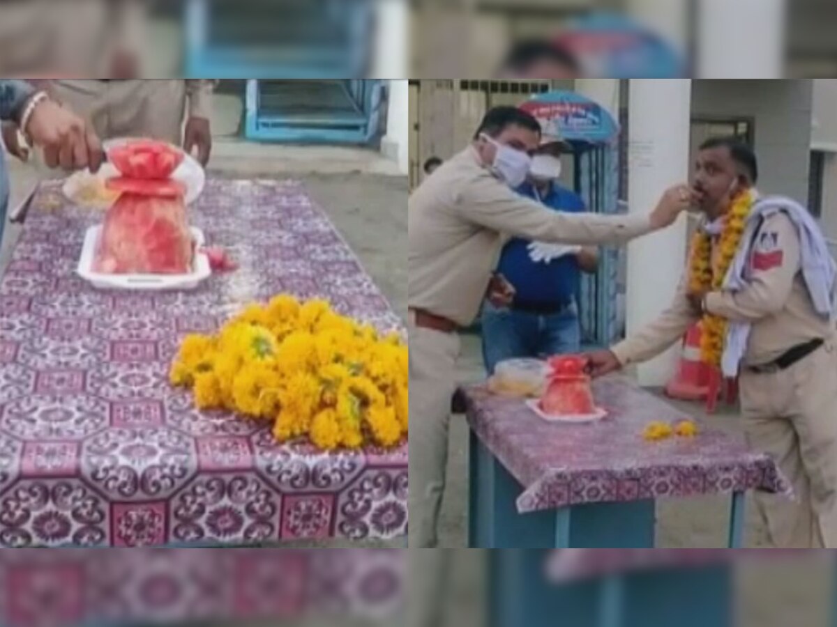 कॉन्स्टेबल सुरेश शाक्या प्रधान का तरबूज केक काटकर जन्मदिन मनाते साथी पुलिस कर्मी
