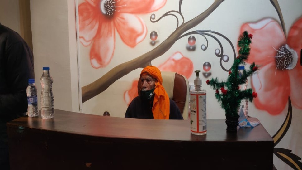 Baba Kanta prasad sitting at the counter of his new restaurants