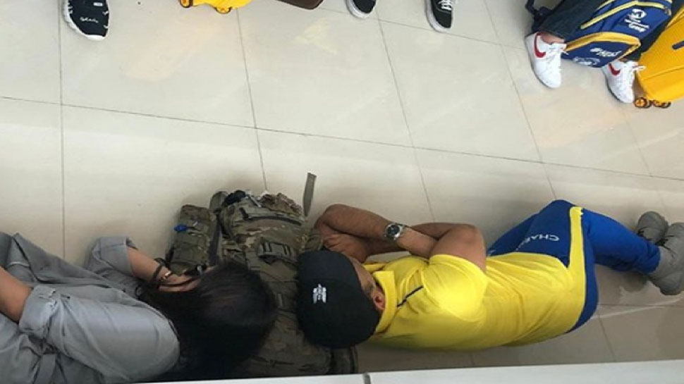 Dhoni lying on airport
