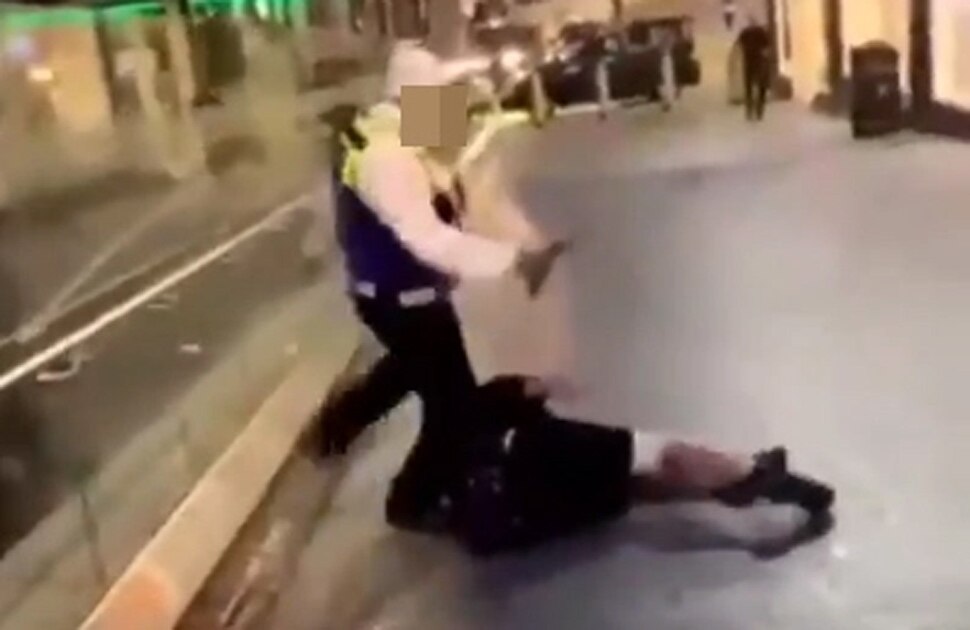 guard was seen kicking woman