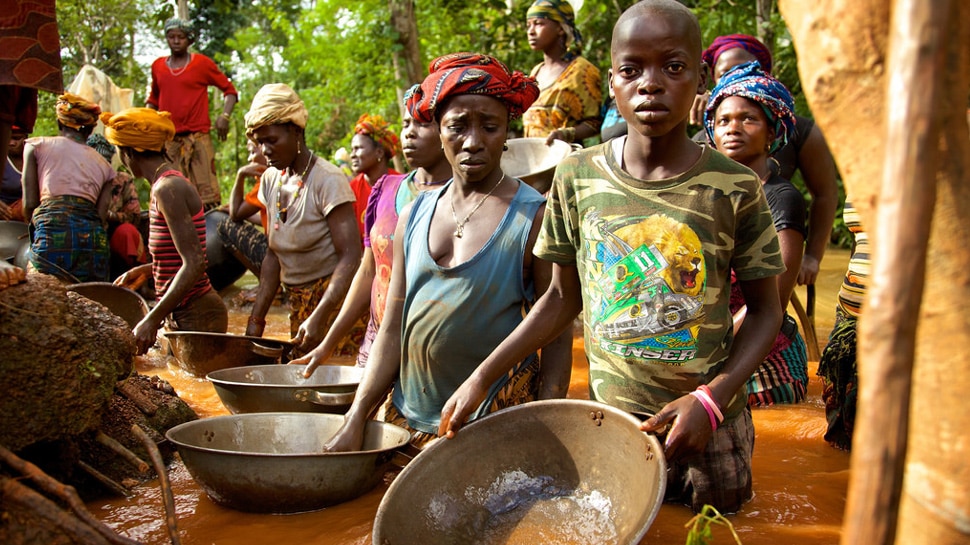 people extracting gold from mud