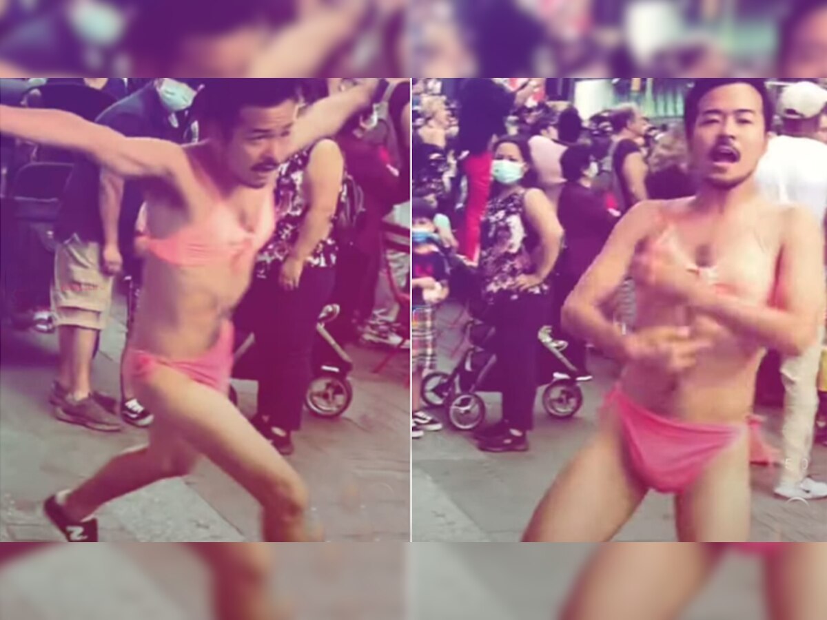 अचानक बीच सड़क पर लड़कियों की बिकनी पहनकर यूं पोल डांस करने लगा शख्स, Video ने उड़ाए होश