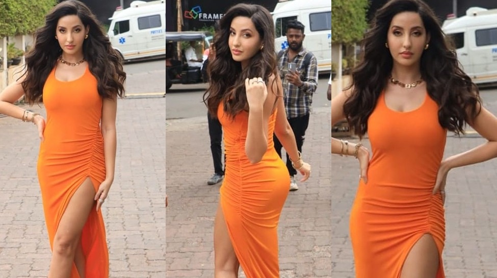 Nora Fatehi Flaunts Curves In Hot And Bold Orange Thigh High Slit Gown Gives Killer Poses On