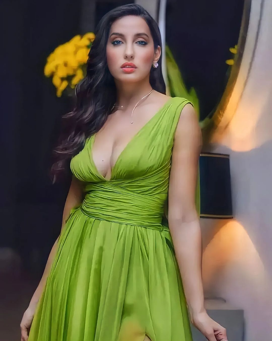 Nora Fatehi wreaked havoc again in a deep neck dress, posing in front of the camera by going braless