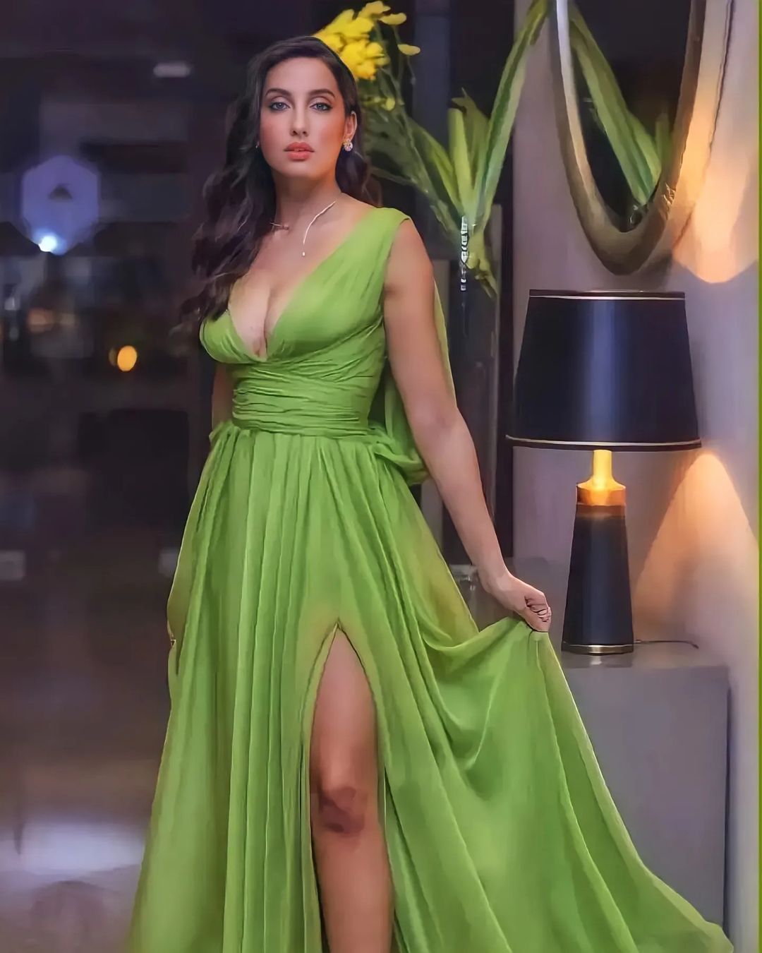 Nora Fatehi wreaked havoc again in a deep neck dress, posing in front of the camera by going braless