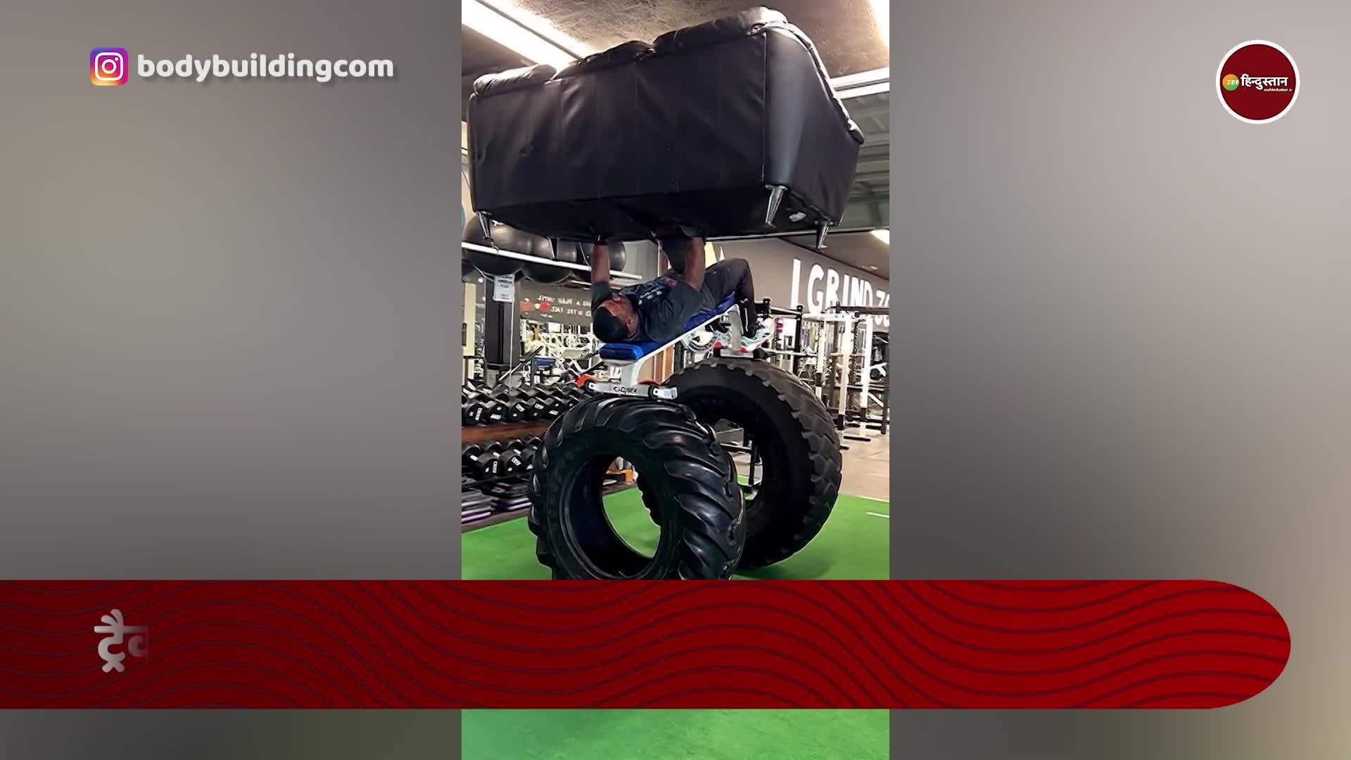 man does weight lifting with sofa tractors tyre watch weight lifter of
