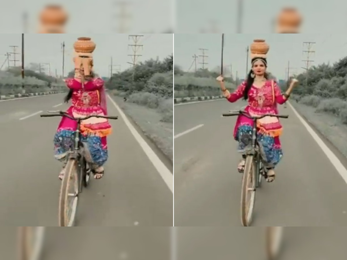 Dance Video: OMG! इस लड़की को देखते रह गए बड़े-बड़े स्टंटमैन; सिर के ऊपर कलश, हाथ छोड़ साइकिल पर...