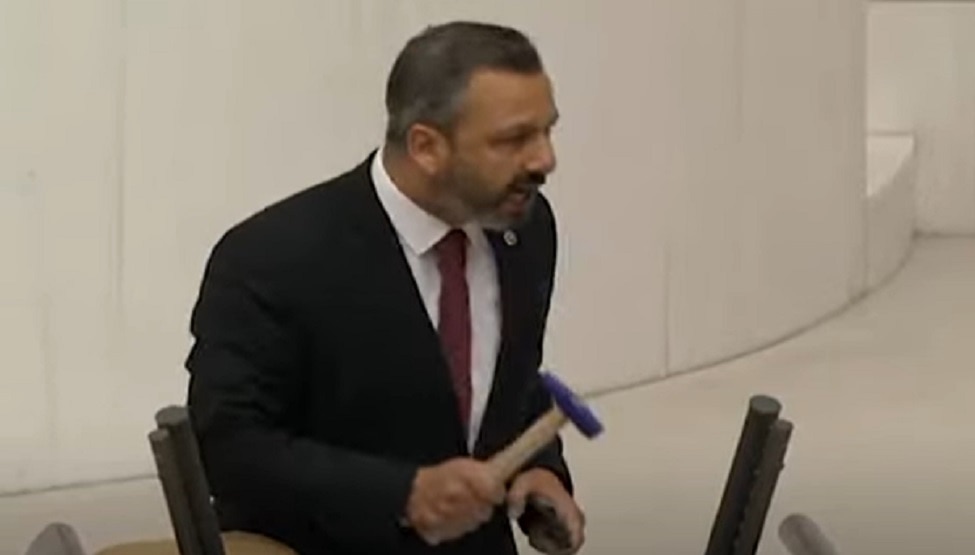 While Speaking In Parliament Turkish Mp Broke His Mobile With Hammer while-speaking-in-parliament-turkish-mp-broke-his-mobile-with-hammer