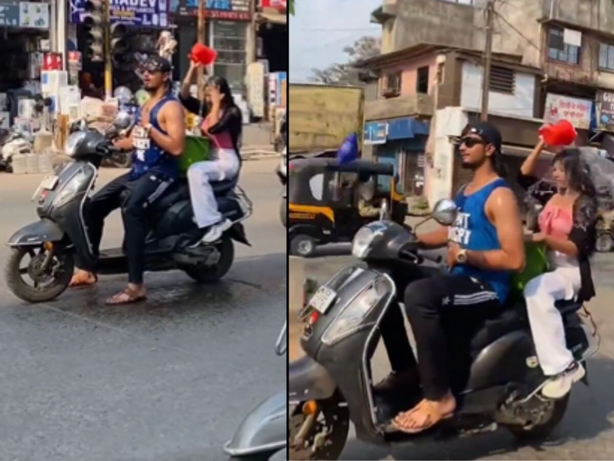 Boy and Girl Bathing on Scooty Photo