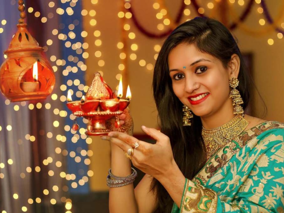Beautiful Indian Girl Holding Diya On Diwali Festival Night Top  Viewselective Focus Stock Photo - Download Image Now - iStock