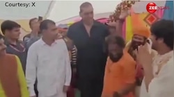 The Great Khali ने दिखाई अपनी ताकत! बाबा बागेश्वर के सामने चोटी पकड़ कर एक हाथ से साधु को उठाया, देखें ये वीडियो...