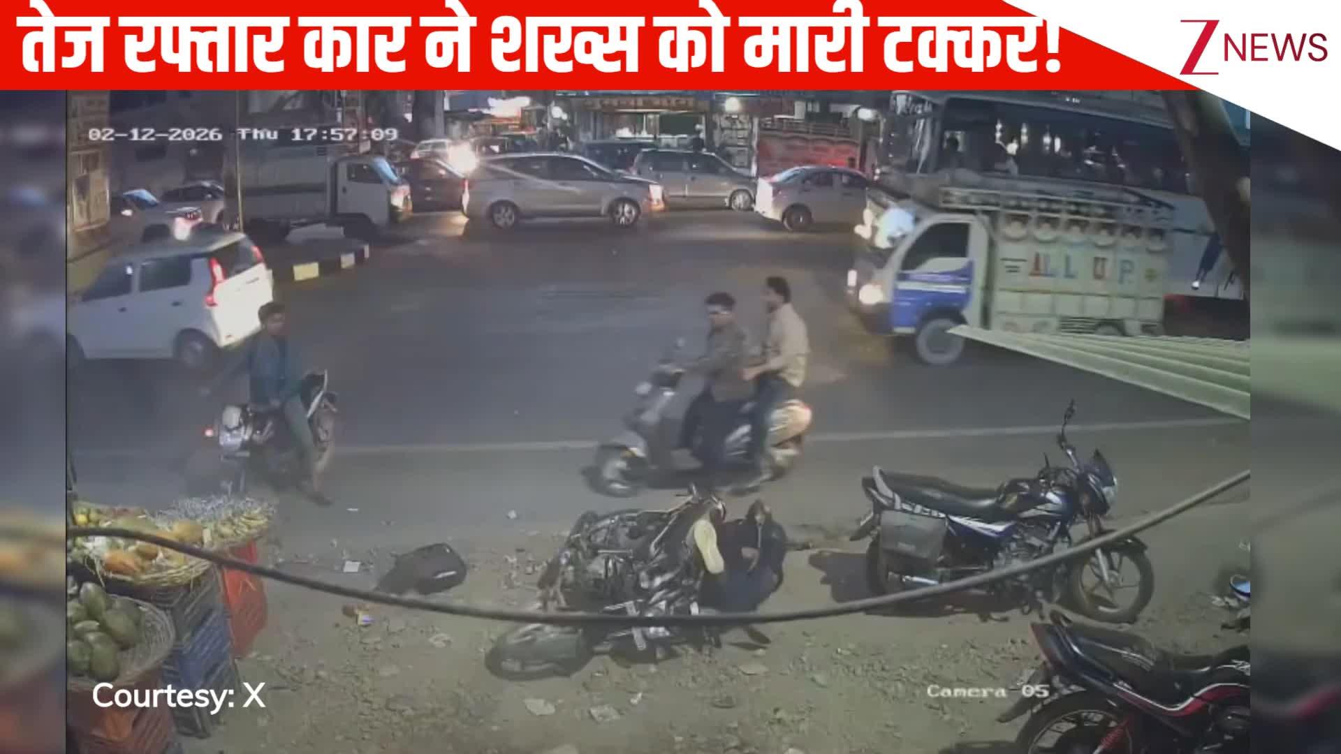 speeding car hits man sitting on bike on side of road calmly he fell on ...