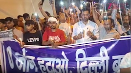 O-Zone के विरोध में जगतपुर-मिलन विहार में कैंडल मार्च निकालकर लोगों ने किया प्रदर्शन