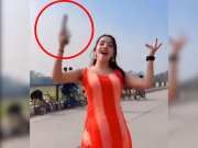 Watch viral Video of influencer dancing while waving gun on highway 