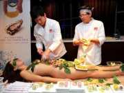 Food is served on the body of a girl Nyotaimori tradition is hundreds of years old in japan