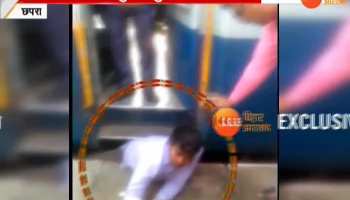 A young man trapped between the train and the platform
