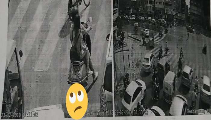 ट्रैफिक रूल्स तोड़ते कैमरे में कैद हुआ कपल, कटा जिंदगी भर का चालान ट्रैफिक रूल्स तोड़ते कैमरे में कैद हुआ कपल, कटा जिंदगी भर का चालान