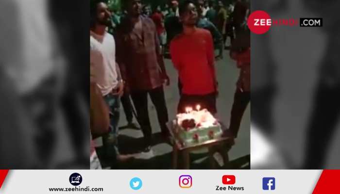 birthday cake cut with a sword on the road in Surat