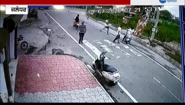 Scooty rider beaten by 2 youths in Jalandhar Scooty rider beaten by 2 youths in Jalandhar