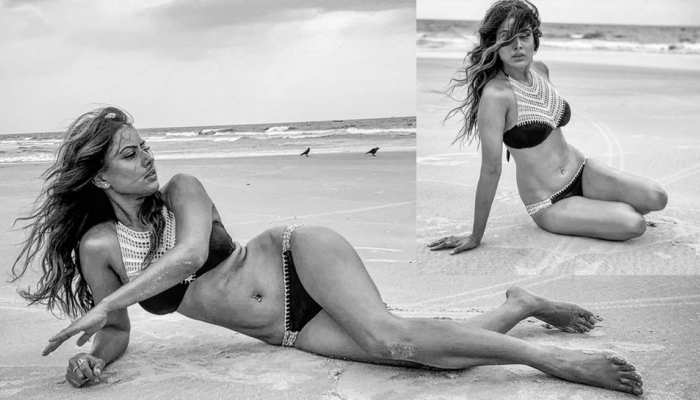 Nia Sharma rested on the sand in a black bikini, take a breather Nia Sharma rested on the sand in a black bikini, take a breather