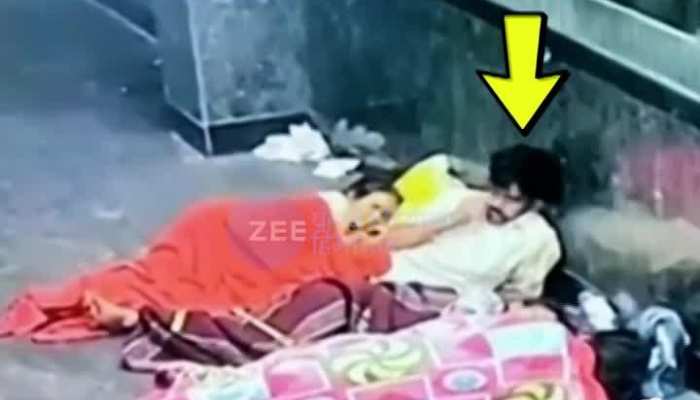 Young man lying in the middle of mother and daughter sleeping at the station VIDEO Viral