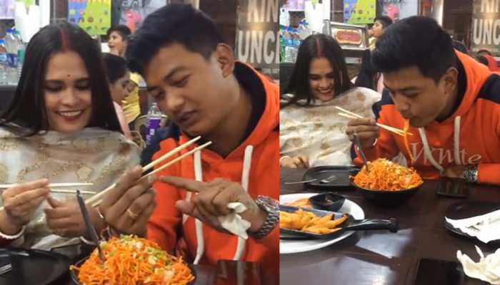 Husband was teaching wife to eat noodles in restaurant people called True  Love Watch Video | रेस्टोरेंट लेकर गया था पति, लेकिन पत्नी को नहीं आता था  नूडल्स खाना; फिर जो हुआ