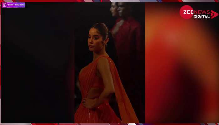 Janhvi Kapoor: ऑरेंज कलर के फ्रंट कट चोली पर टिकी फैंस की निगाहें, एक्ट्रेस के रैम्प पर उतरते ही मचा तहलका!