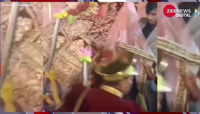 Viral Video: स्टेज से दुल्हन को गोद में उठाए उतर रहा था दूल्हा, तभी अचानक हुआ कुछ ऐसा की दुल्हन को करने लगा किस