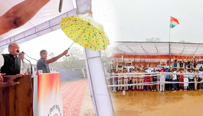 Ashok Gehlot : भारी बारिश में छाता तान गहलोत देते रहे भाषण, कहा-कांग्रेस का सत्य संघर्ष नहीं रुकेगा