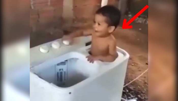 Viral video : वाशिंग मशीन में घुसा बच्चा फिर ऑन कर दी बटन , इसके बाद जो हुआ वो हैरान करने वाला https://english.cdn.zeenews.com/static/apprun/fallbackimages/hindi800x400.svg