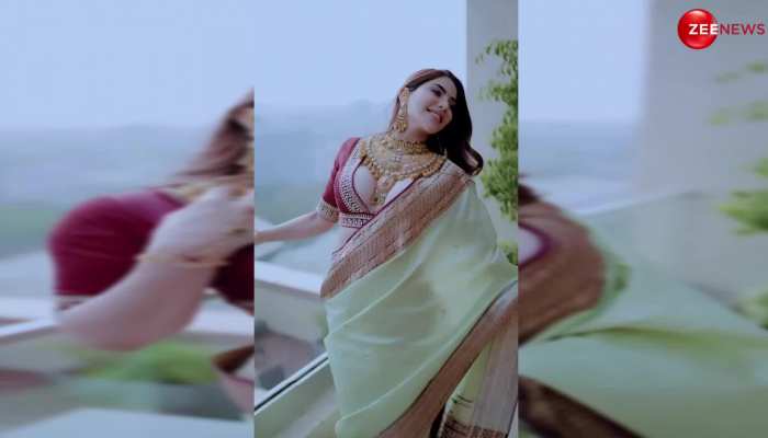 Ufff! Nikki Tamboli ने इतनी नीचे साड़ी बांध बालकनी में दिखाई ऐसी अदाएं, देख छूटे जवान लड़कों के पसीने https://english.cdn.zeenews.com/static/apprun/fallbackimages/hindi800x400.svg