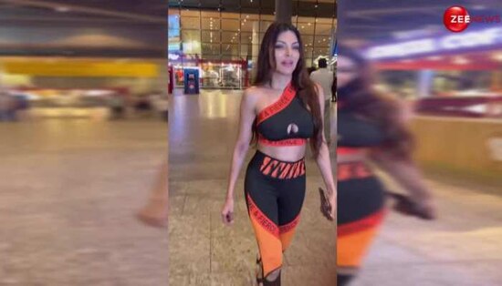 sherlyn chopra nip show again at airport exposing breast in sporty bra