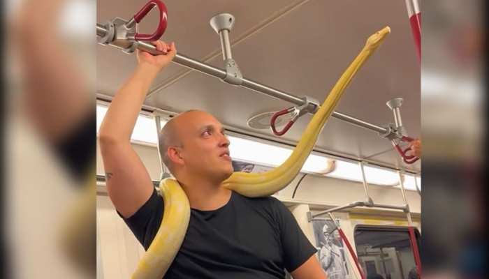 Python Wrapped Around Neck Snake video Giant python wrapped around man neck in metro watch king ...