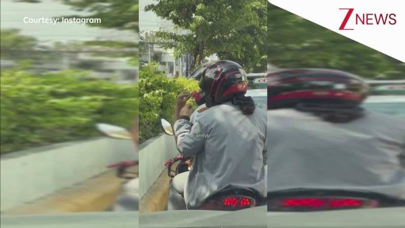 बाइक पर बैठी प्रेमिका को प्यार से फूल देता हुआ नजर आया प्रेमी, लोग बोले- 'मर्द अपनी पसंदीदा औरत को खुश करते हुए