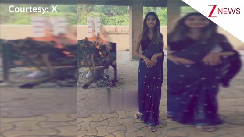अरे दीदी कुछ तो शर्म करो! पीछे जल रही थी चिता, आगे लड़की ने साड़ी में बनाई रील, वीडियो देख ठनका लोगों का माथा!